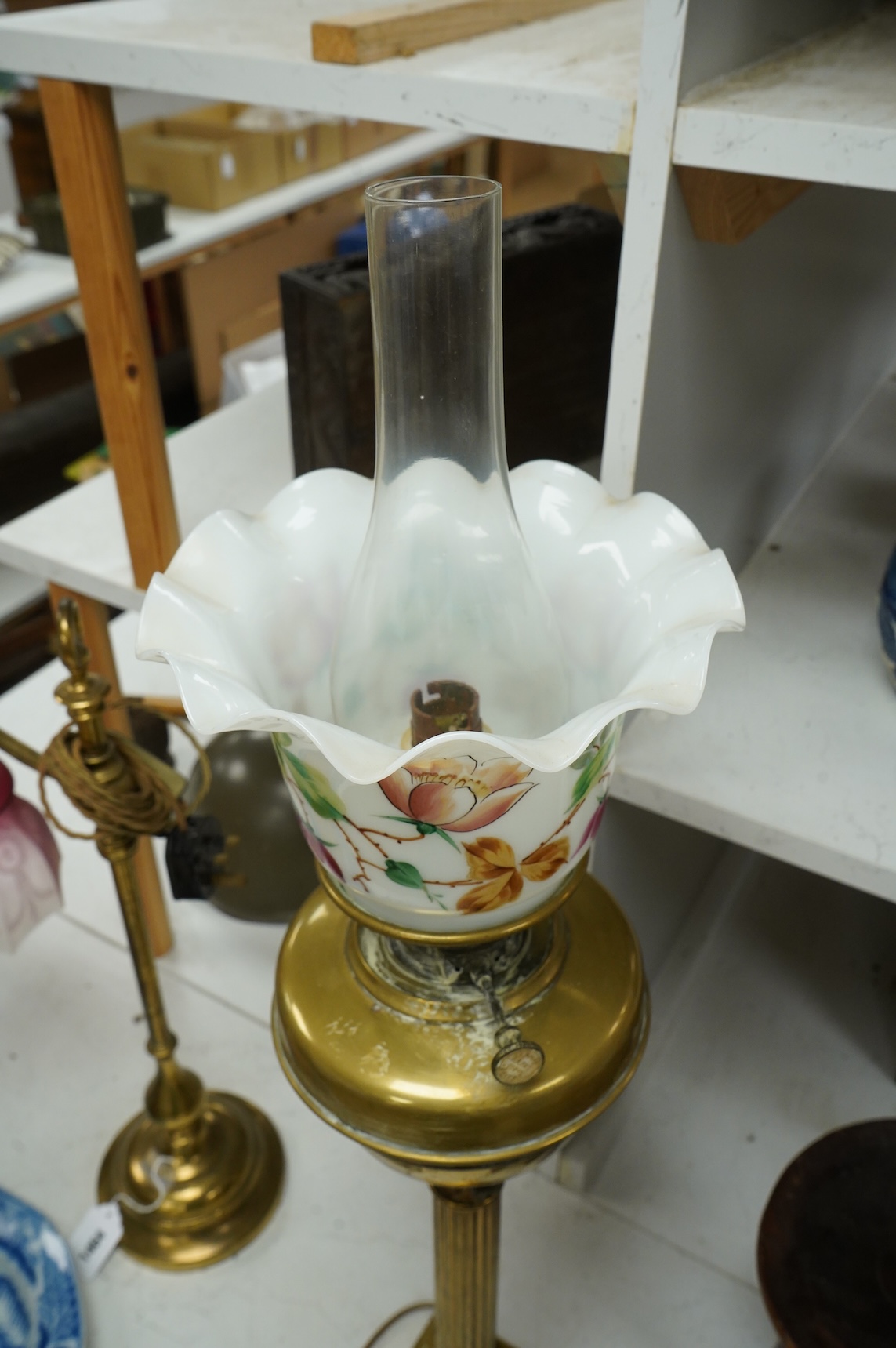 An Edwardian Corinthian column oil lamp, 72 high not including chimney